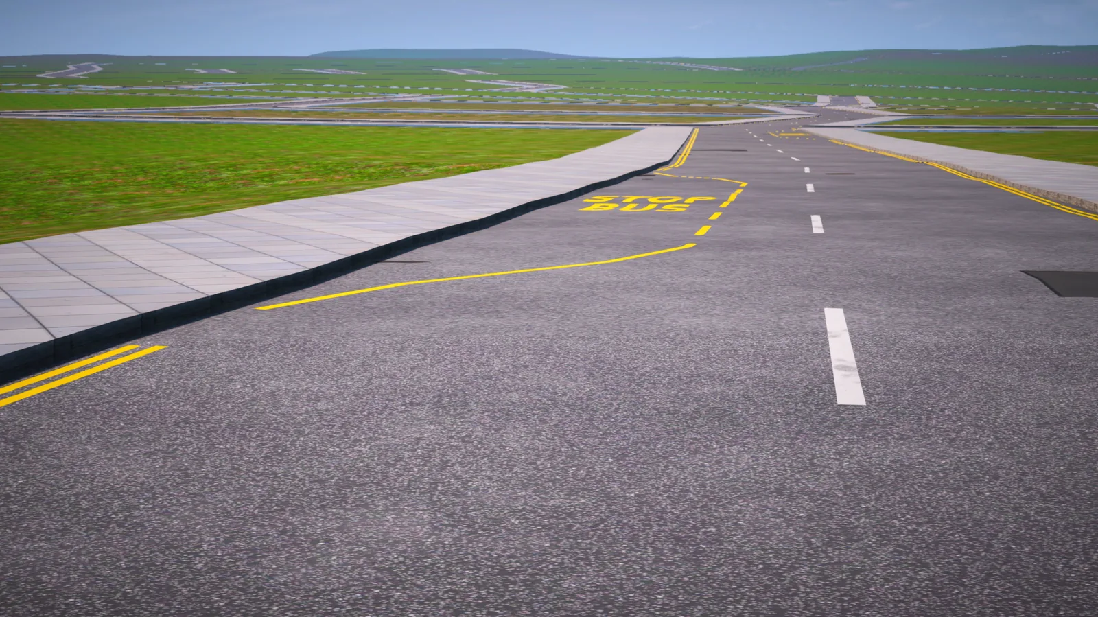 A newly built road with a bus stop stretching to the horizon, with more roads laid out across the land beyond it.